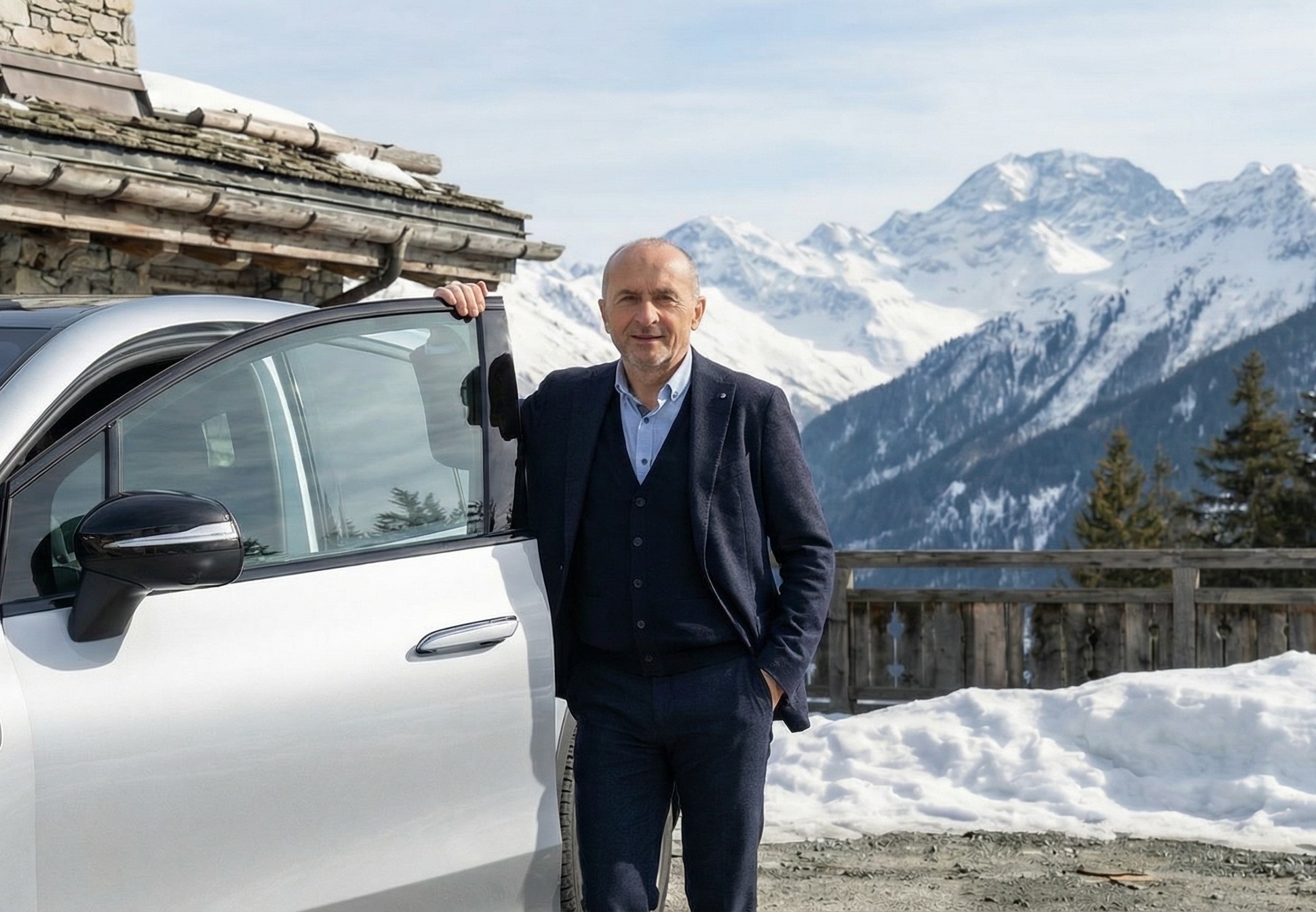 Gabriel, founder of DRIVING VIP, with luxury vehicle in the Alps